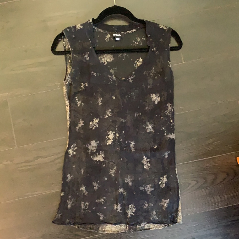 Sheer black top with pale floral pattern